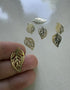 perlesetcreationbijoux - Breloque filigrane feuille en métal - 21x12 mm dorée